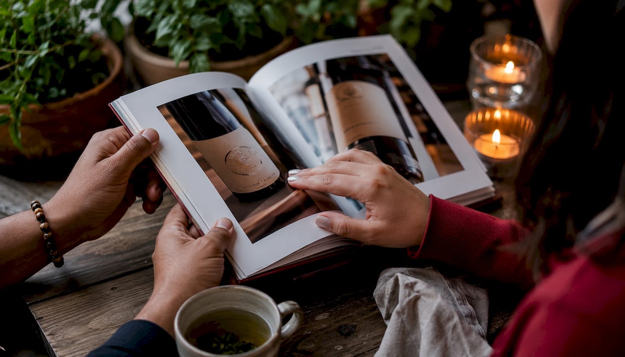 How to Remember Wine Names Easily in 2026 Hands viewing wine label photos on smartphone