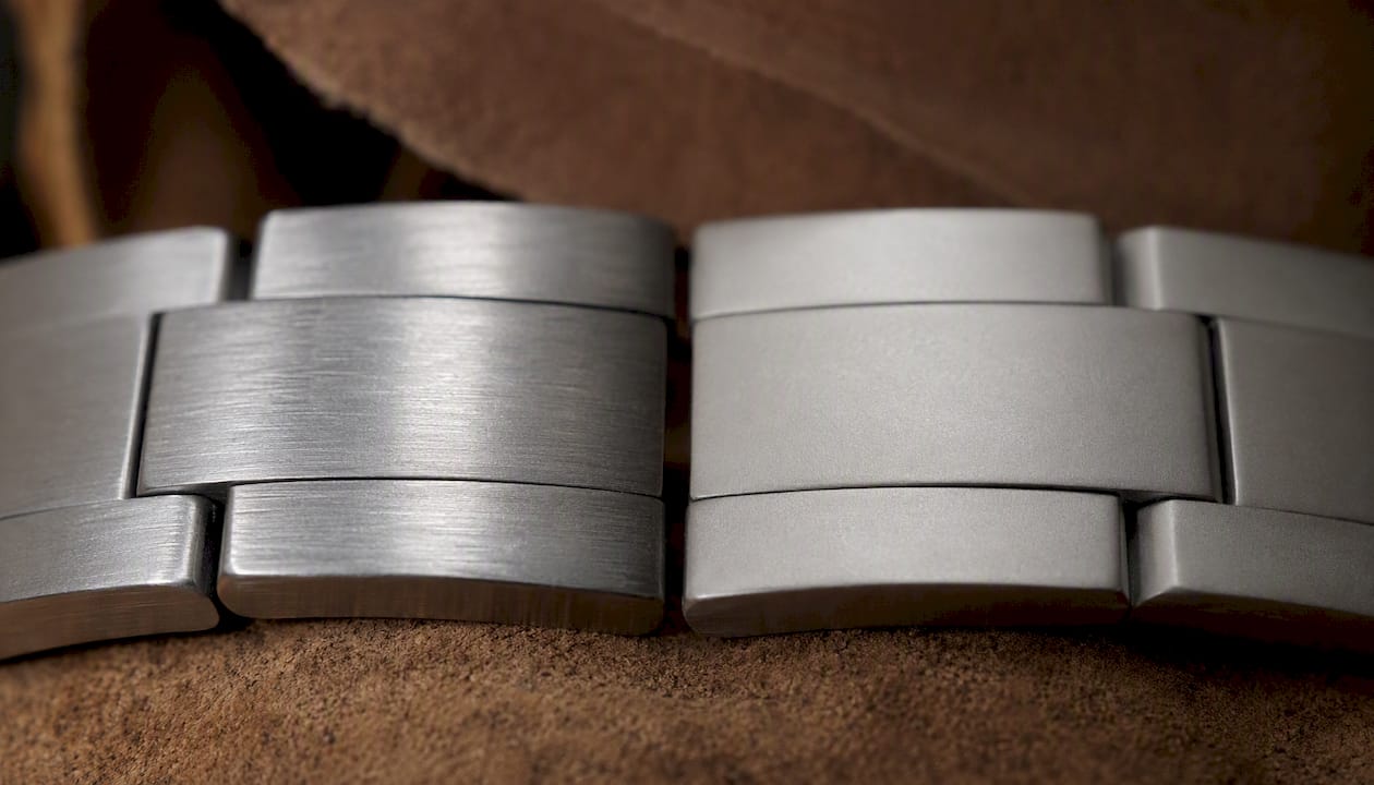 Side-by-side polished and brushed steel watch links