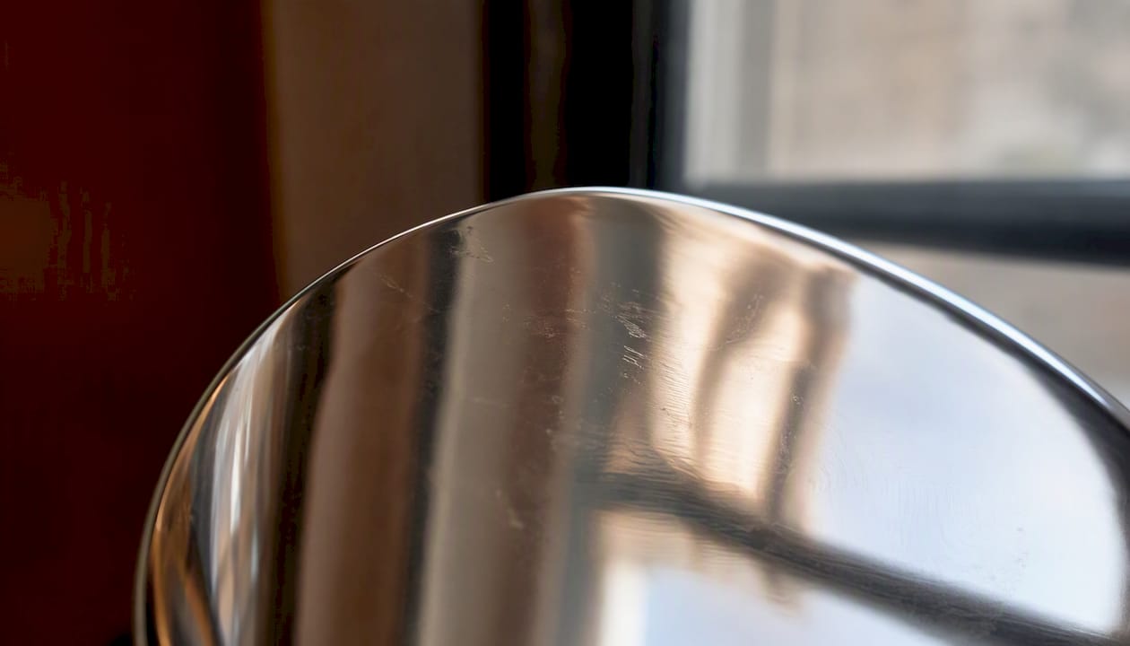 Silver metal surface reflecting colors neutrally