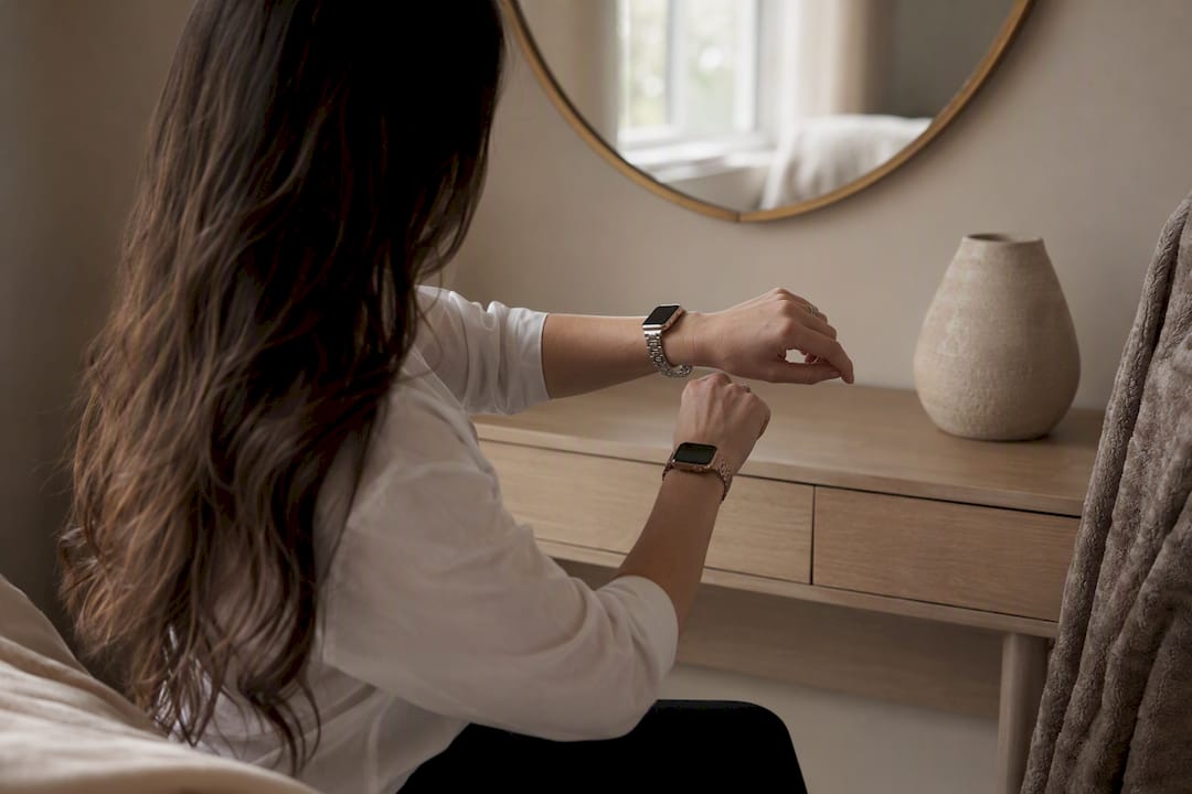 Close side view of woman comparing smartwatch bands on wrist