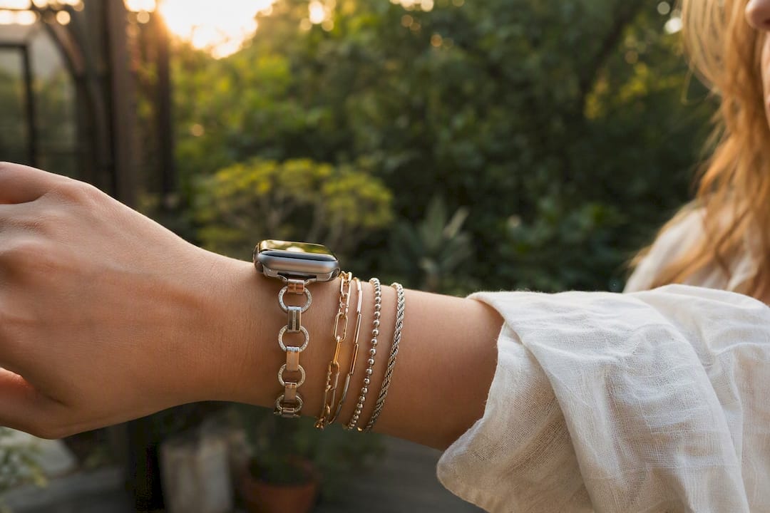 Wrist with mixed-metal bracelets and jewelry-style watch band