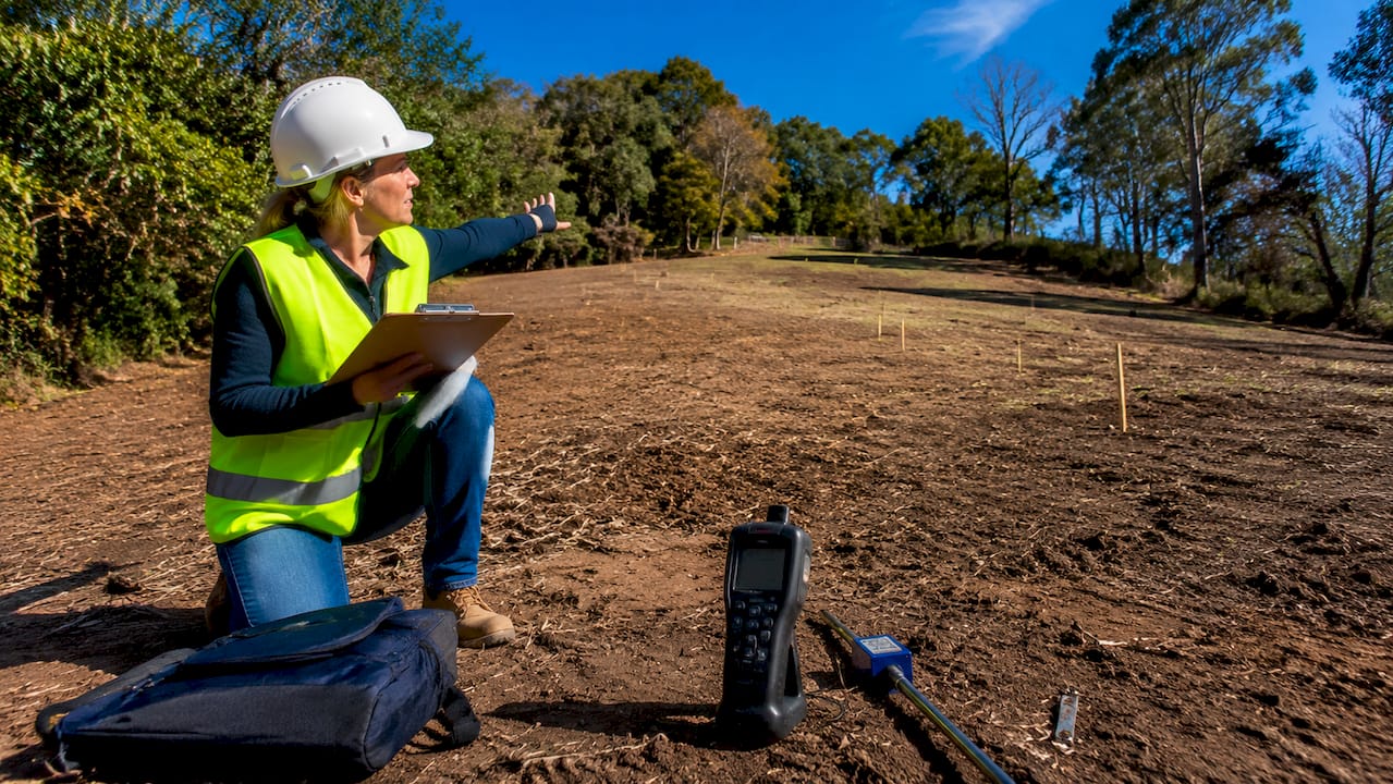 Professional assessing arena site outdoors