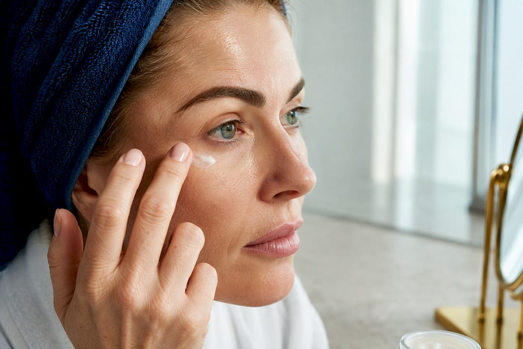 Ring finger gently tapping eye cream