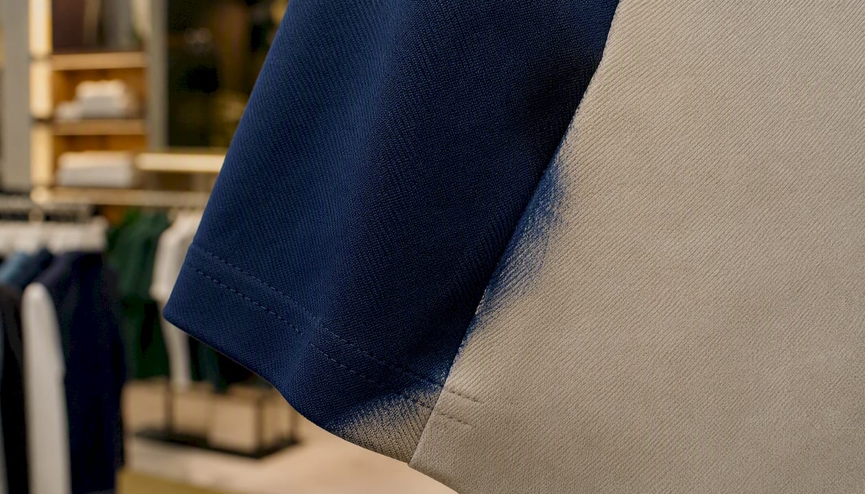 Indigo dyed golf fabric with dye transfer stain