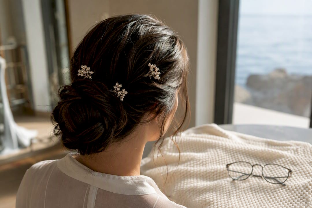 Minimalist bridal hair jewels near eyeglasses