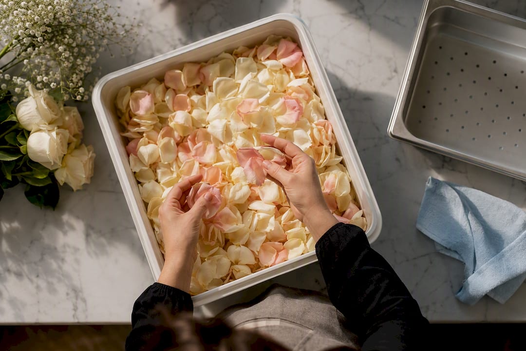 Florist sorting fresh wedding petals