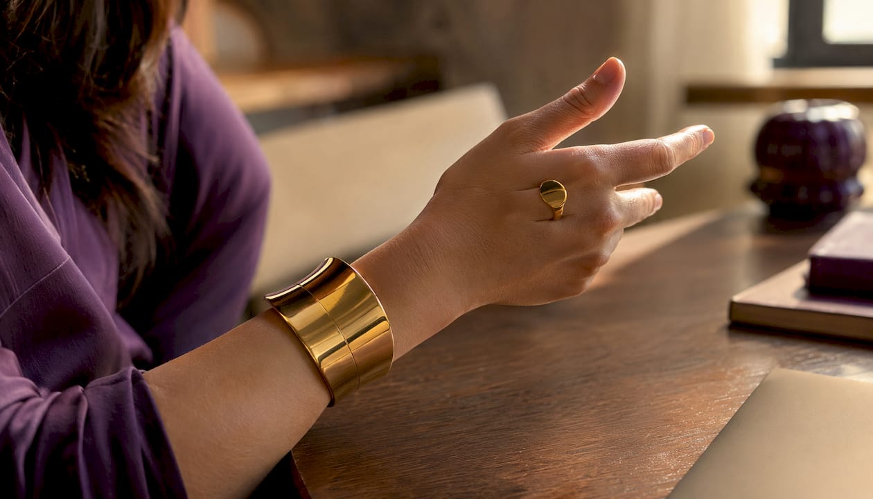 Close-up structured cuff on woman’s gesturing wrist