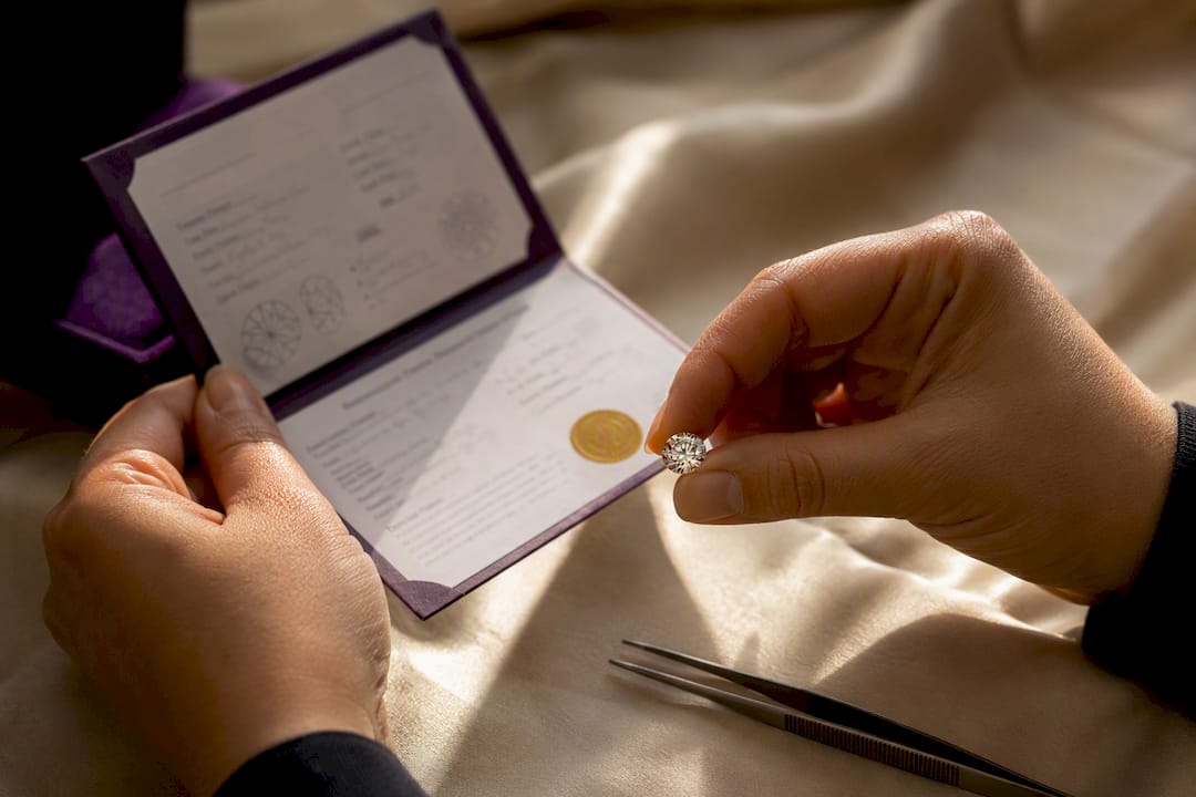 Hands checking moissanite certificate details