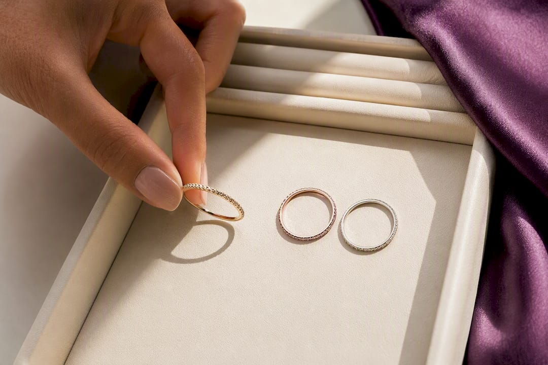 Hand arranging a three-ring stack