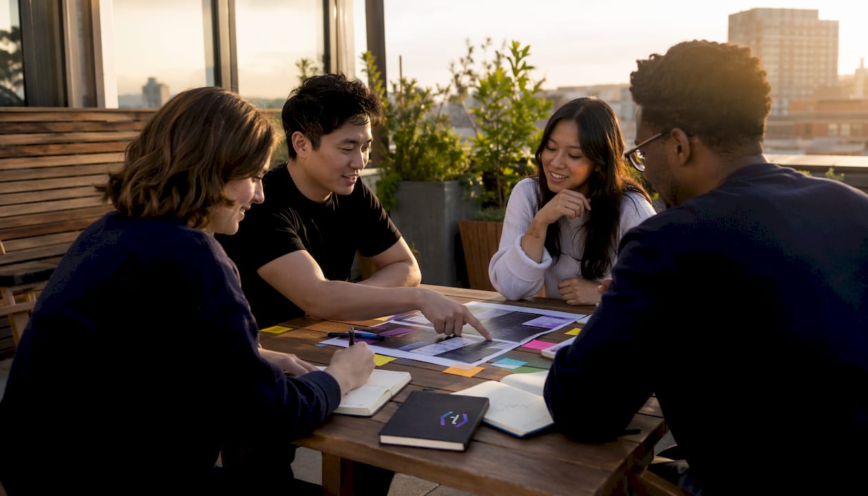 Overhead view of team active in campaign planning session