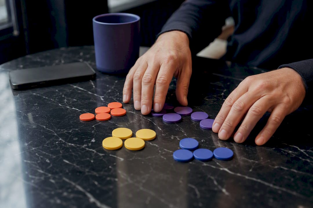 Hands grouping marketing segmentation tokens
