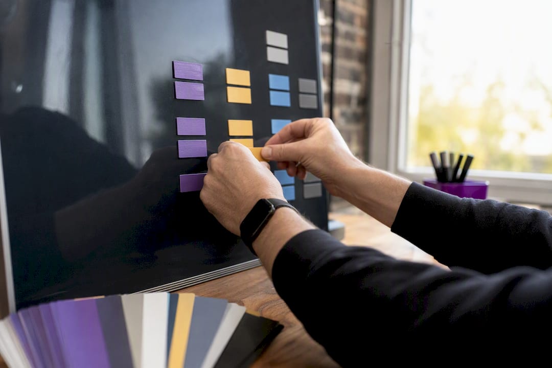 Hands organizing campaign naming tiles on magnetic board