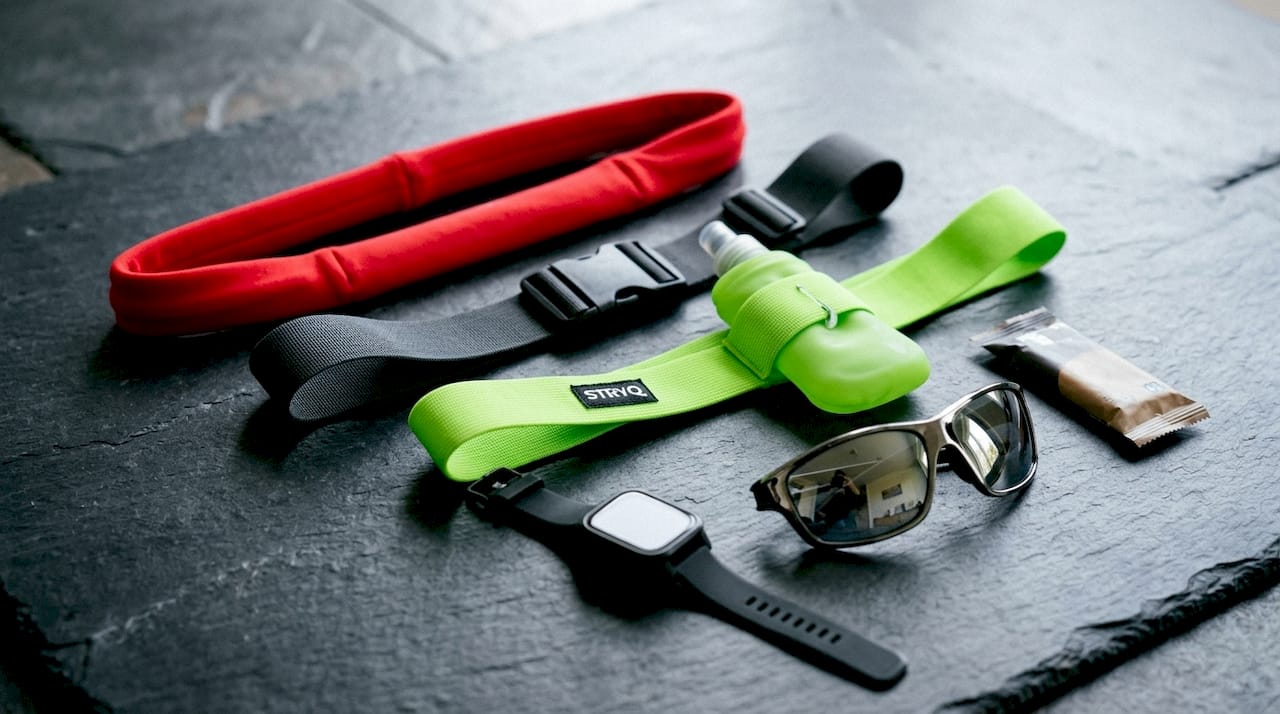 Various running belts arranged flat on table