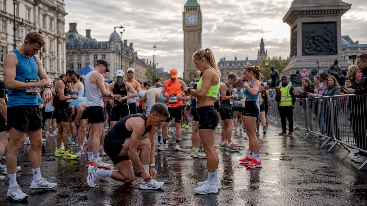 Runners at UK marathon start line, side profile