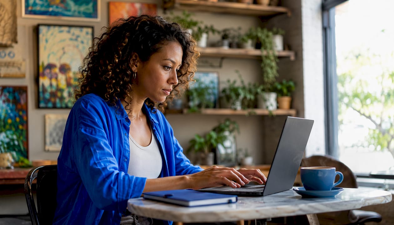 Woman registering as tutor online at home desk