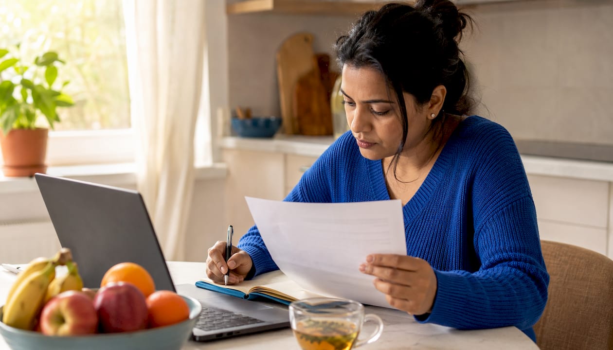 Woman reviewing remote job salary documents