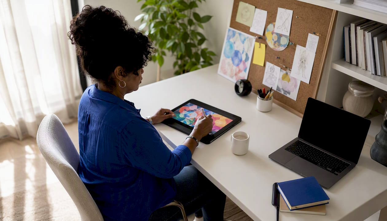 Content creator working on digital products in studio