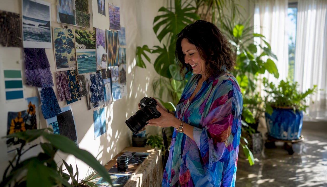 Woman photographing room for mood board integration