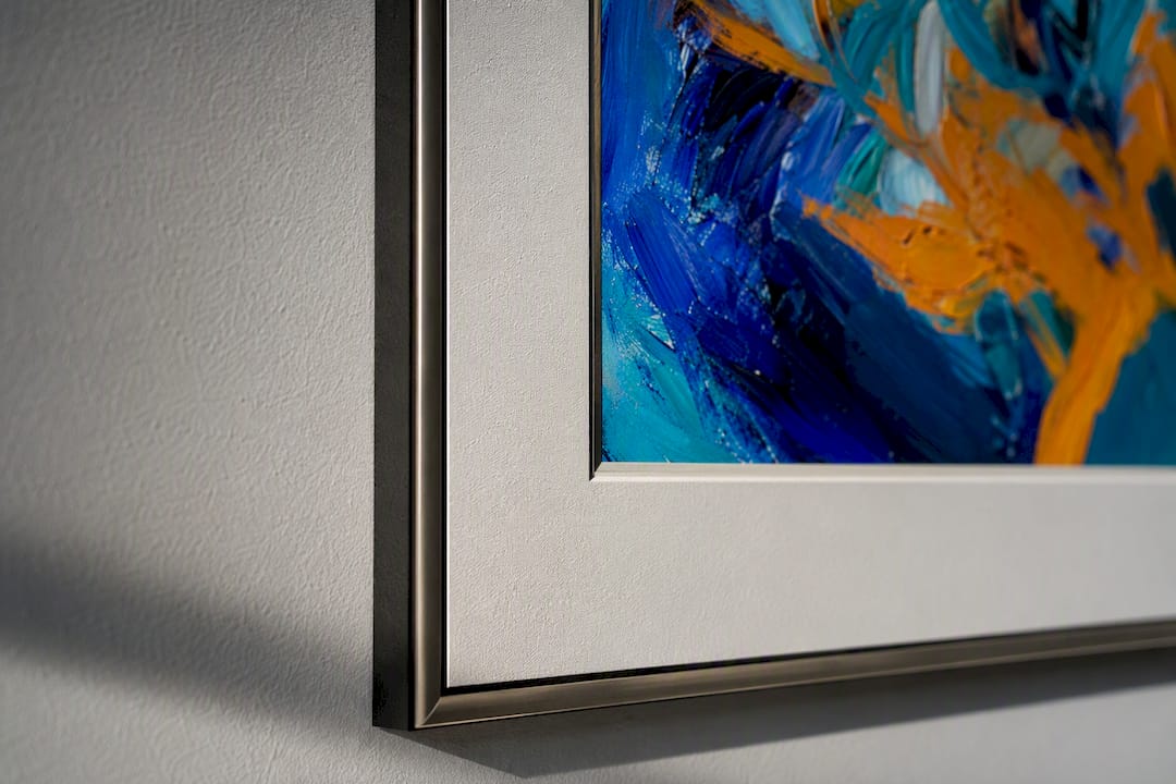 Framed canvas art detail showing frame width