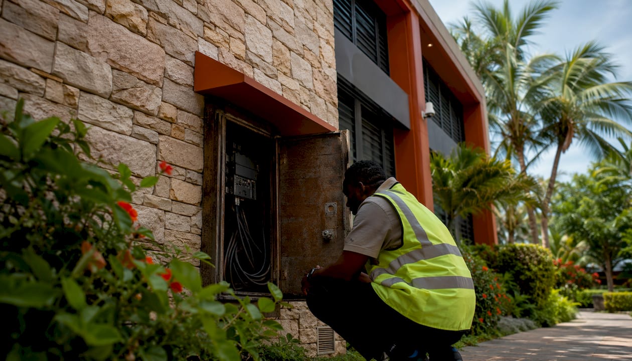 Local Jamaican data center building with security fencing