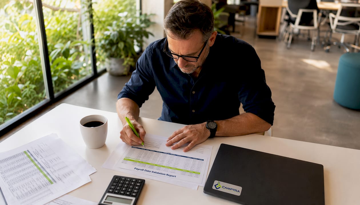 Man reviewing payroll validation report
