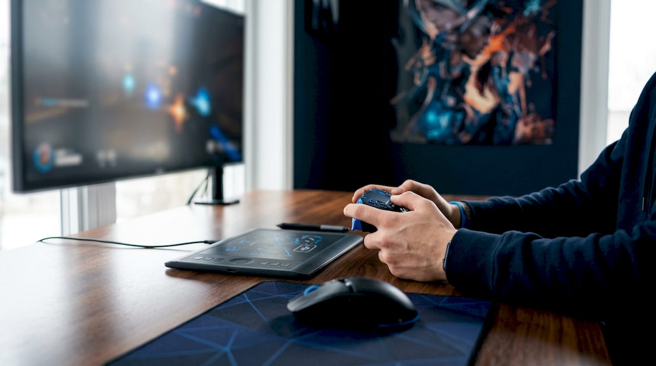 Close-up of hands using controller with visual ping in game
