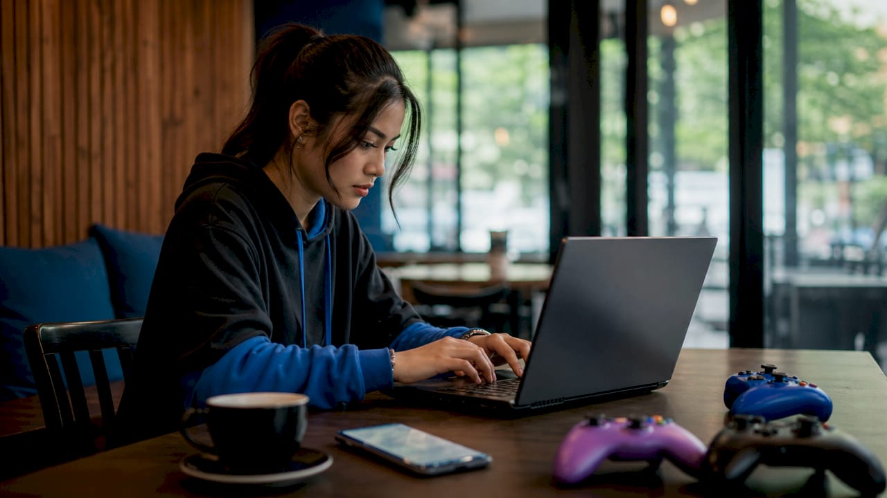 Hands adjusting matchmaking network settings on gaming PC