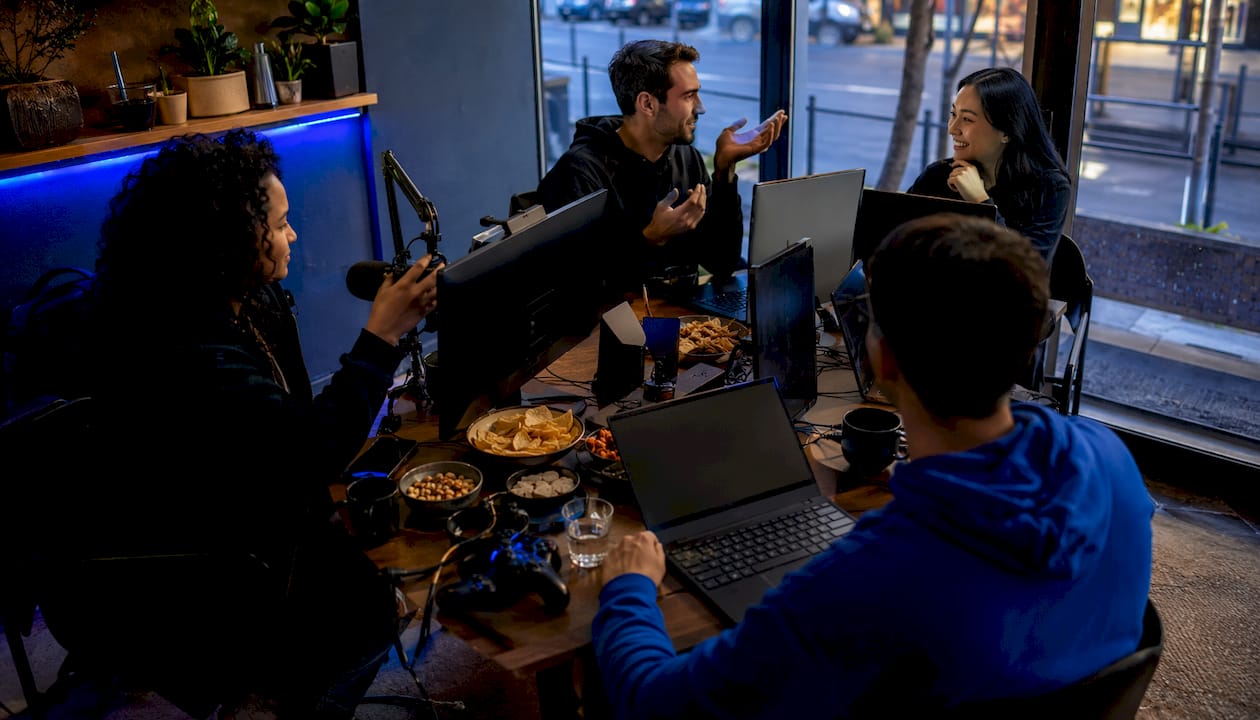 Group of gamers setting up streaming for game night