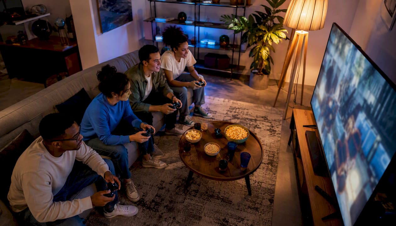Group of friends playing video games together
