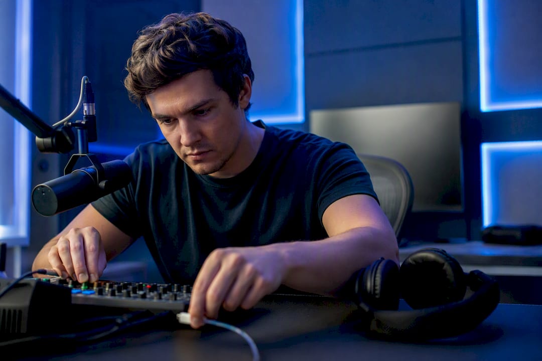 Streamer setting up audio gear for interactive stream