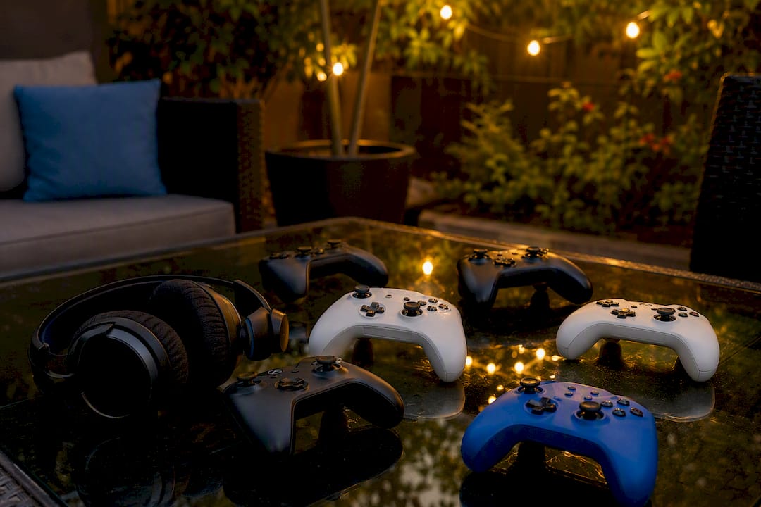 Gaming headset and mixed controllers on a table