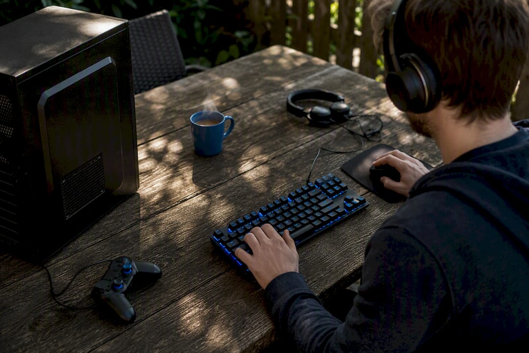 Casual gaming setup with keyboard and controller on table
