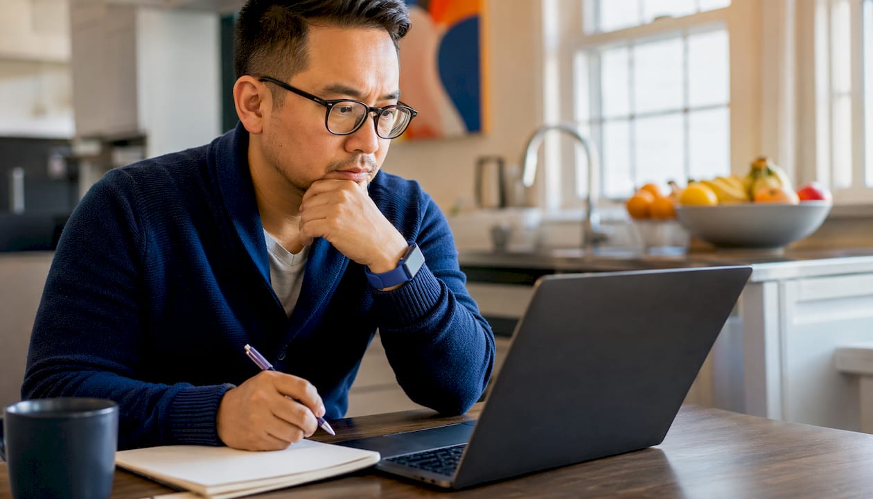 Man evaluating online car buyer offers