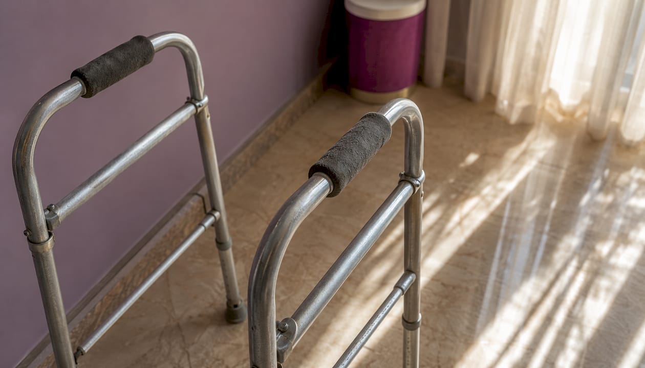 Close-up of standard Zimmer walker on floor