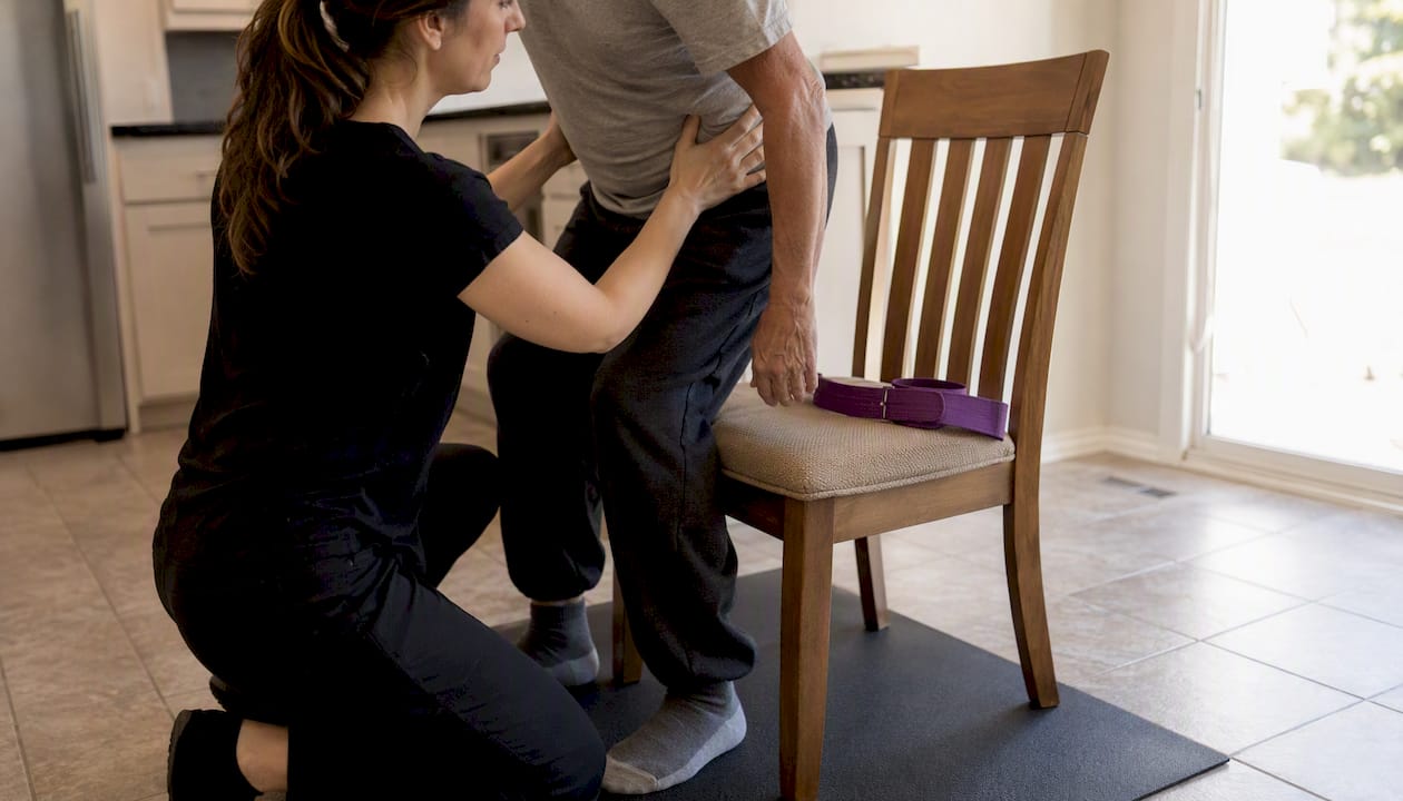 Caregiver assisting patient transfer practice