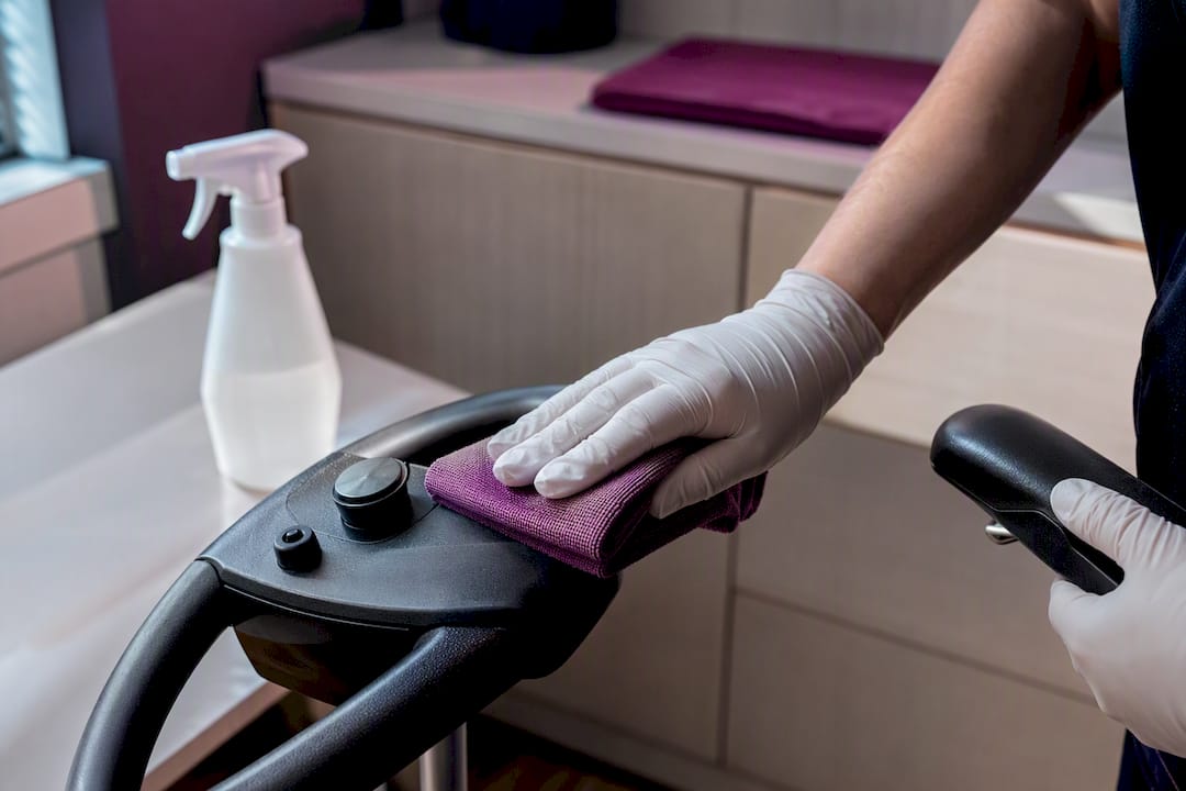 Gloved hand sanitizing scooter control area