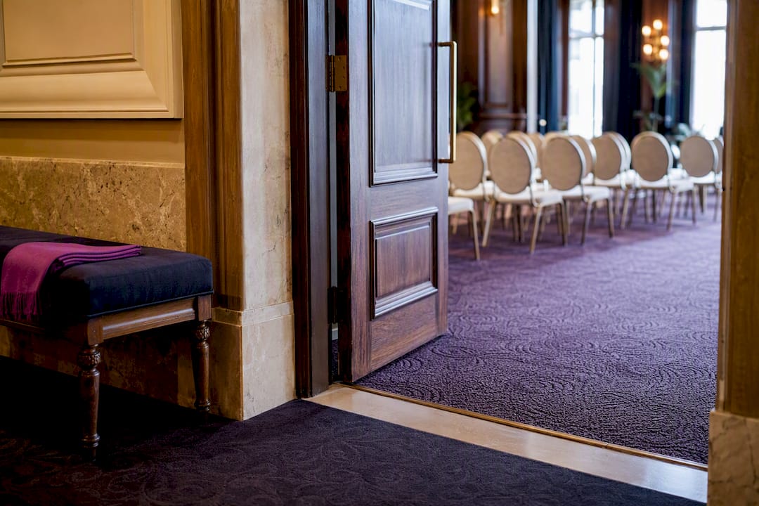 Heritage venue doorway with carpeted access route