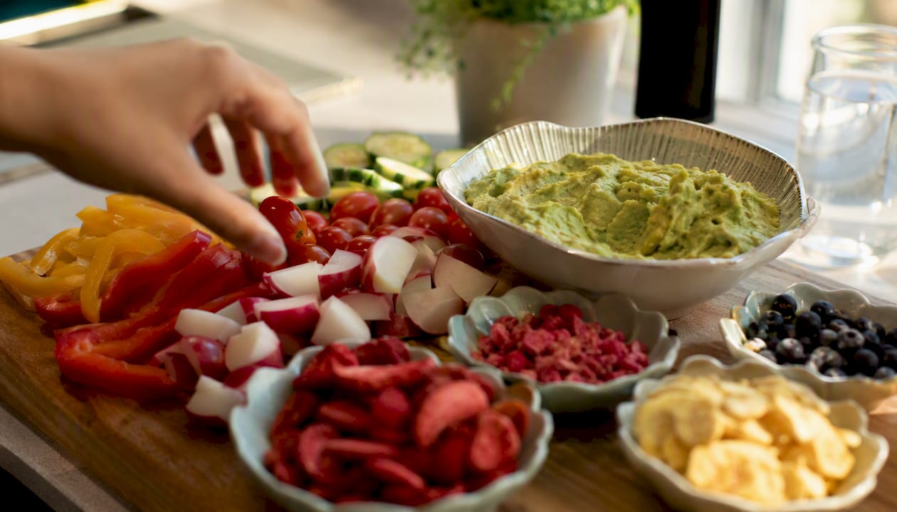 Raw veggies and freeze-dried fruit with hummus dip
