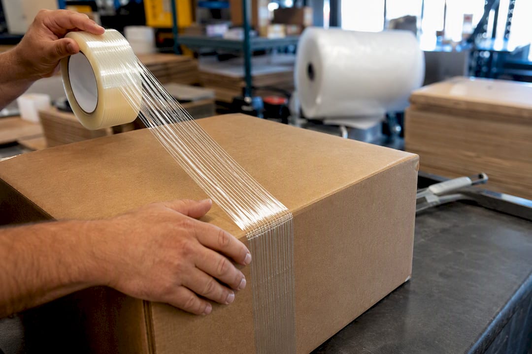 Filament tape reinforcing boxes close-up