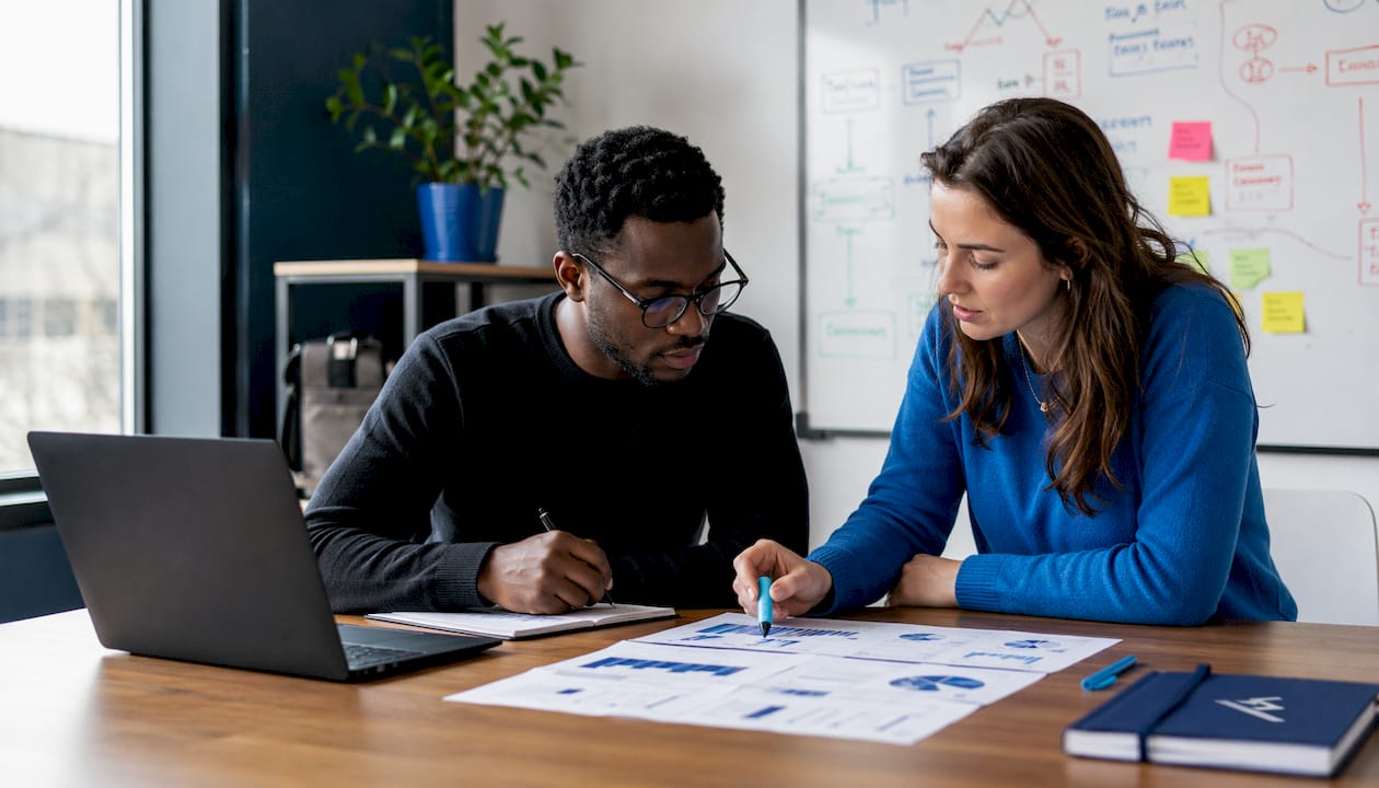 Diverse colleagues collaborating on SaaS forecast