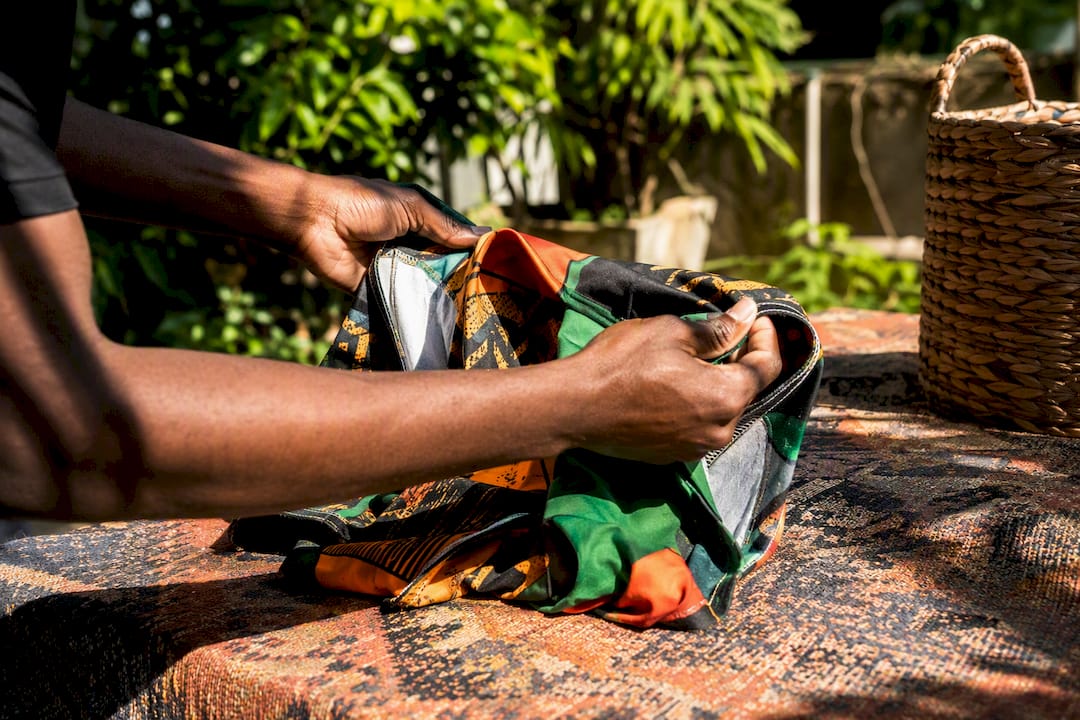 Hands turning garment inside out to protect colors