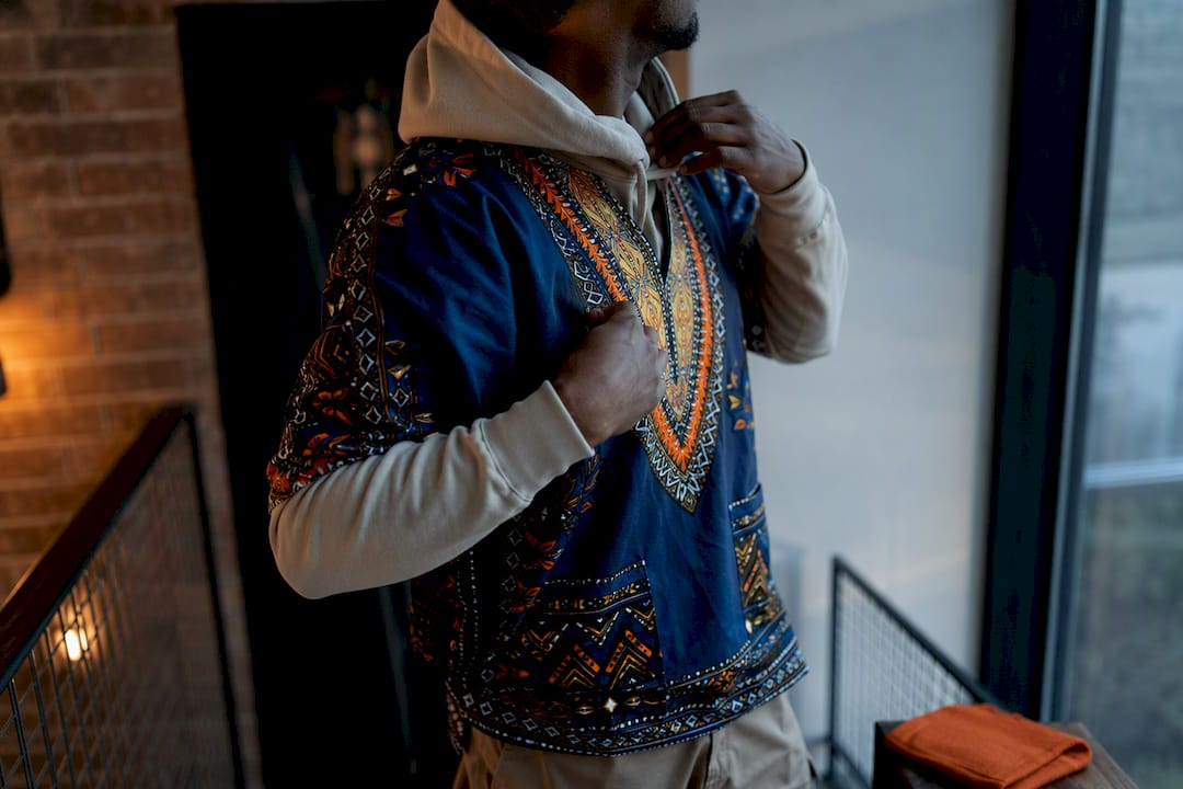 Dashiki layered over a neutral hoodie