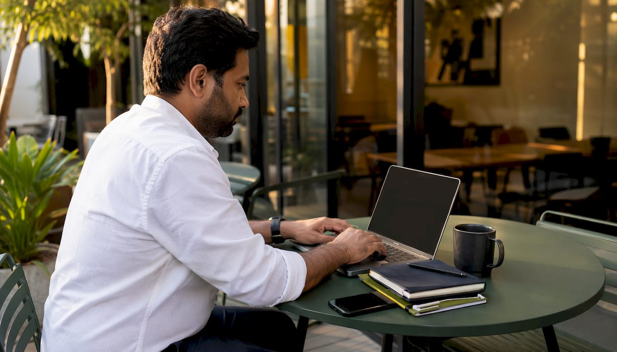 Man coding AI business software at desk