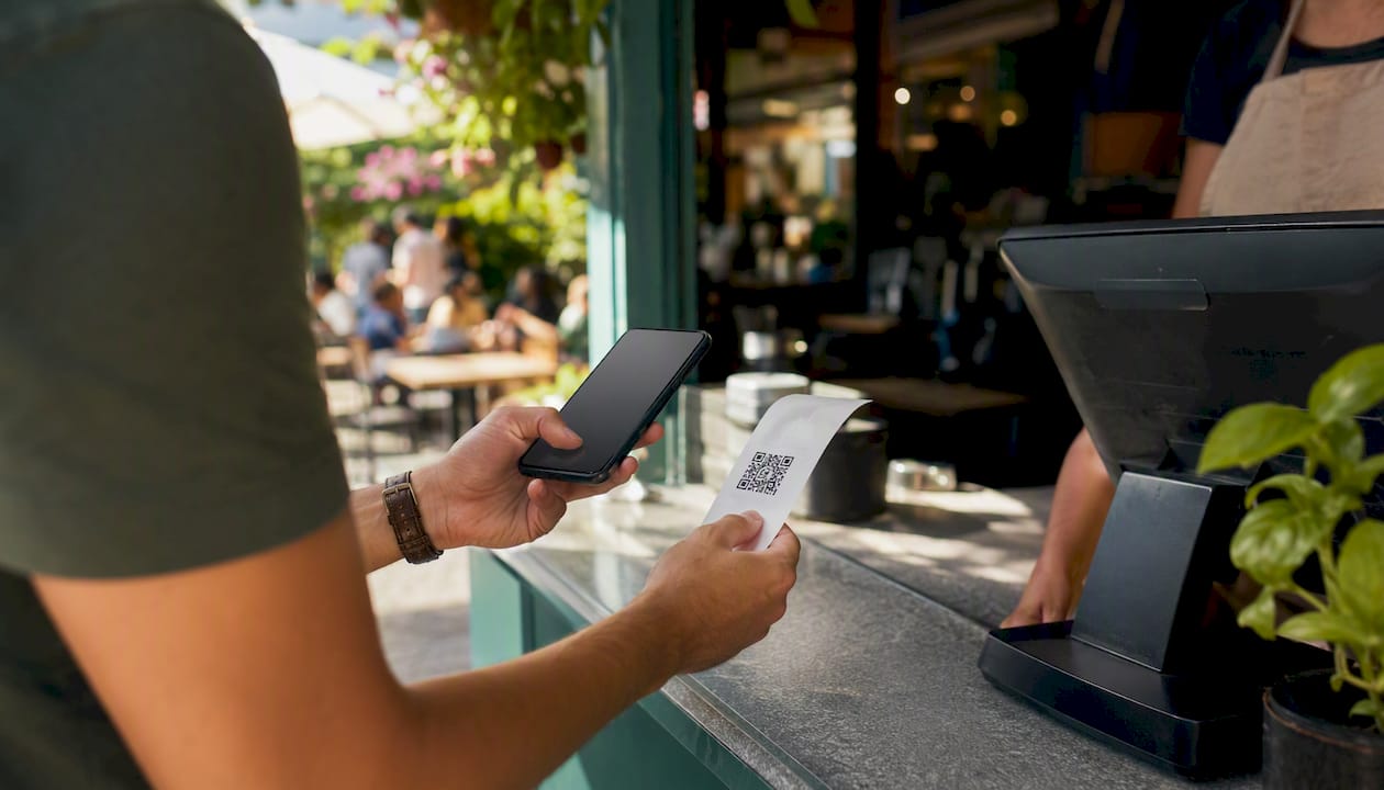 Customer scanning QR code on receipt
