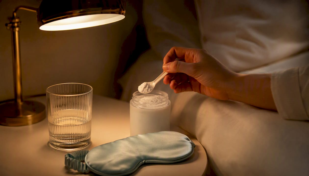 Scoop of glycine powder by bedside lamp