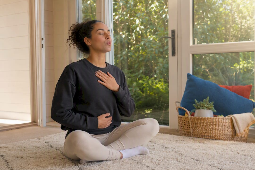 Woman practicing slow extended-exhale breathing