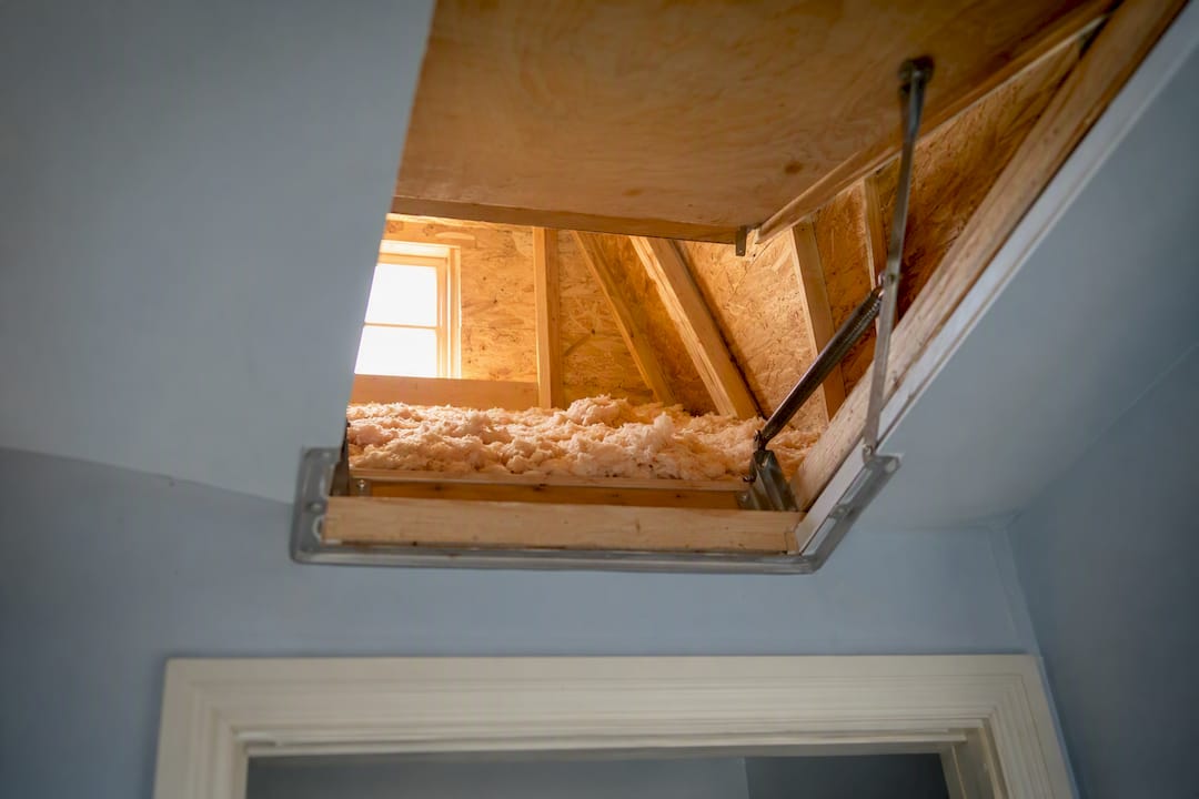 Open attic hatch showing clear access and insulation