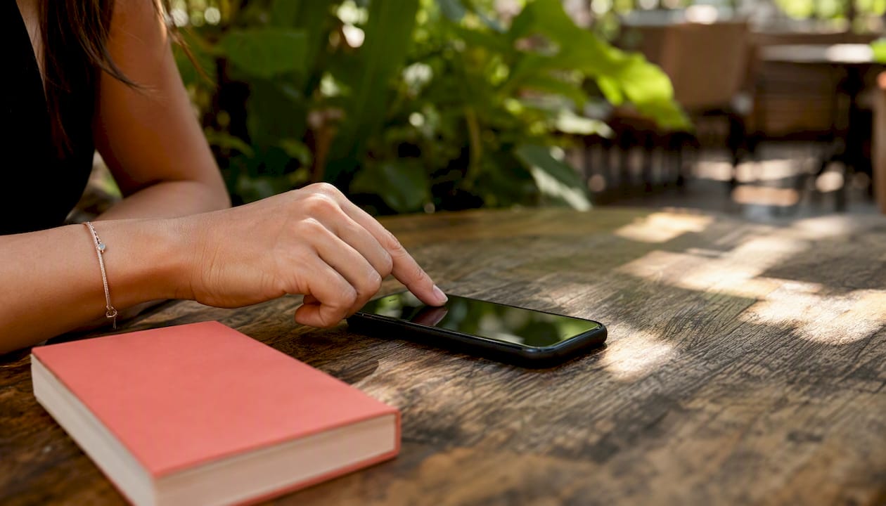 Hand interacting with smartphone for profile setup