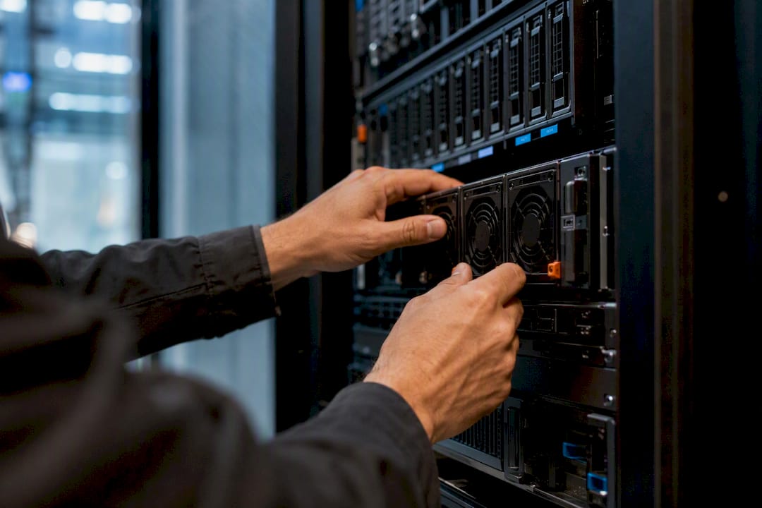 Hands adjusting network switch hardware