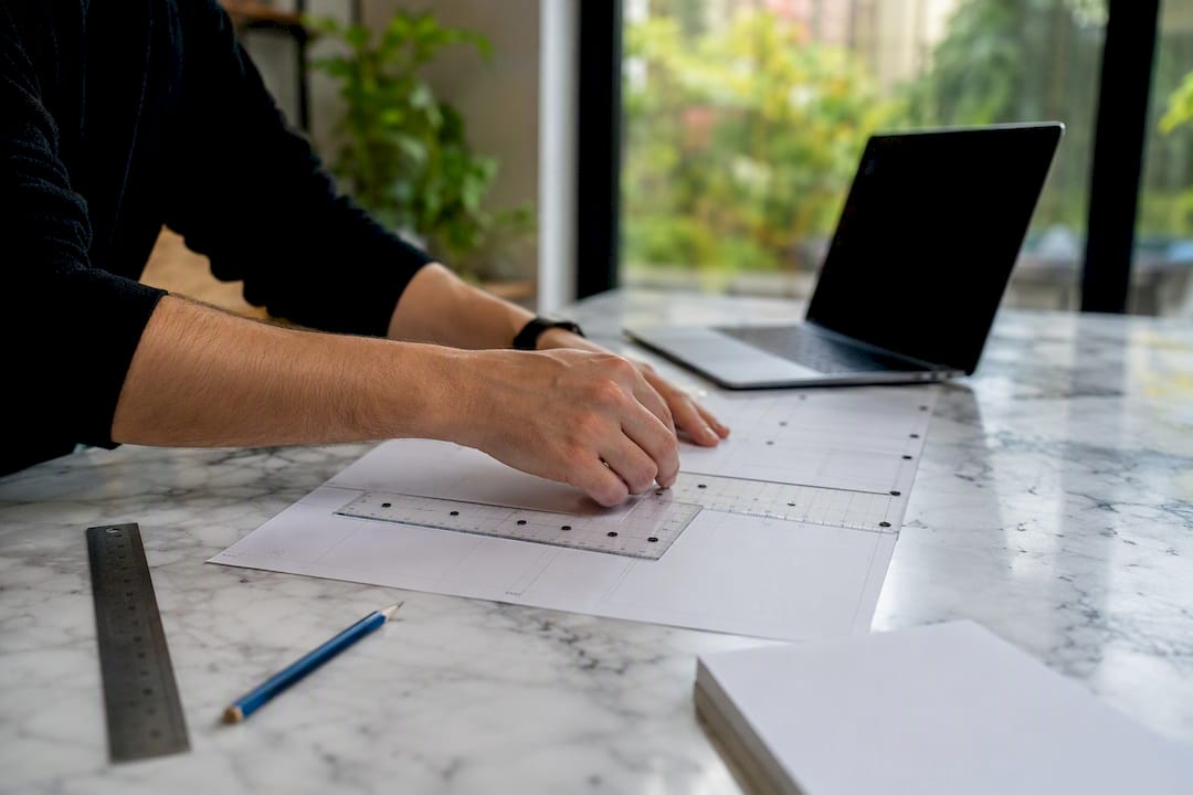 Hand adjusting layout grid tools on design sheets
